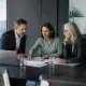 Business professionals discussing strategy in a modern office.