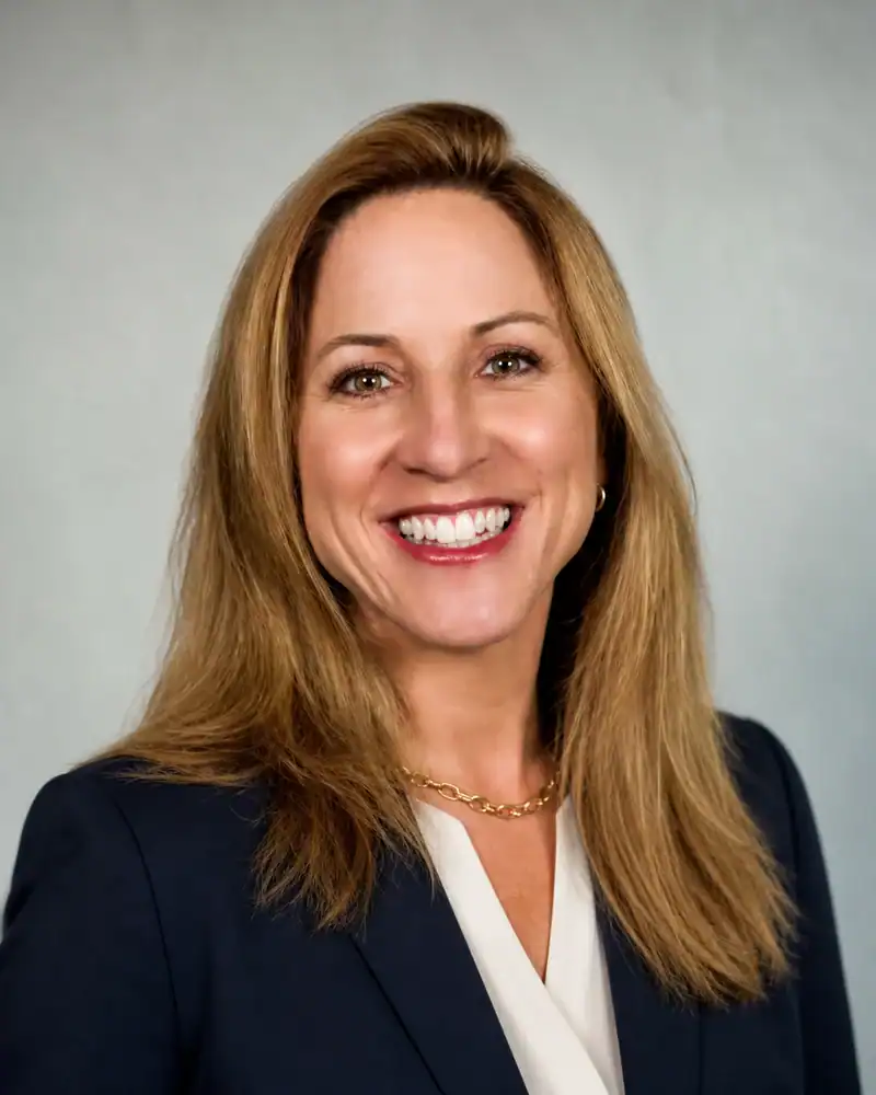 Professional Businesswoman Portrait Confident businesswoman smiling in formal attire for Townsend Strategies.